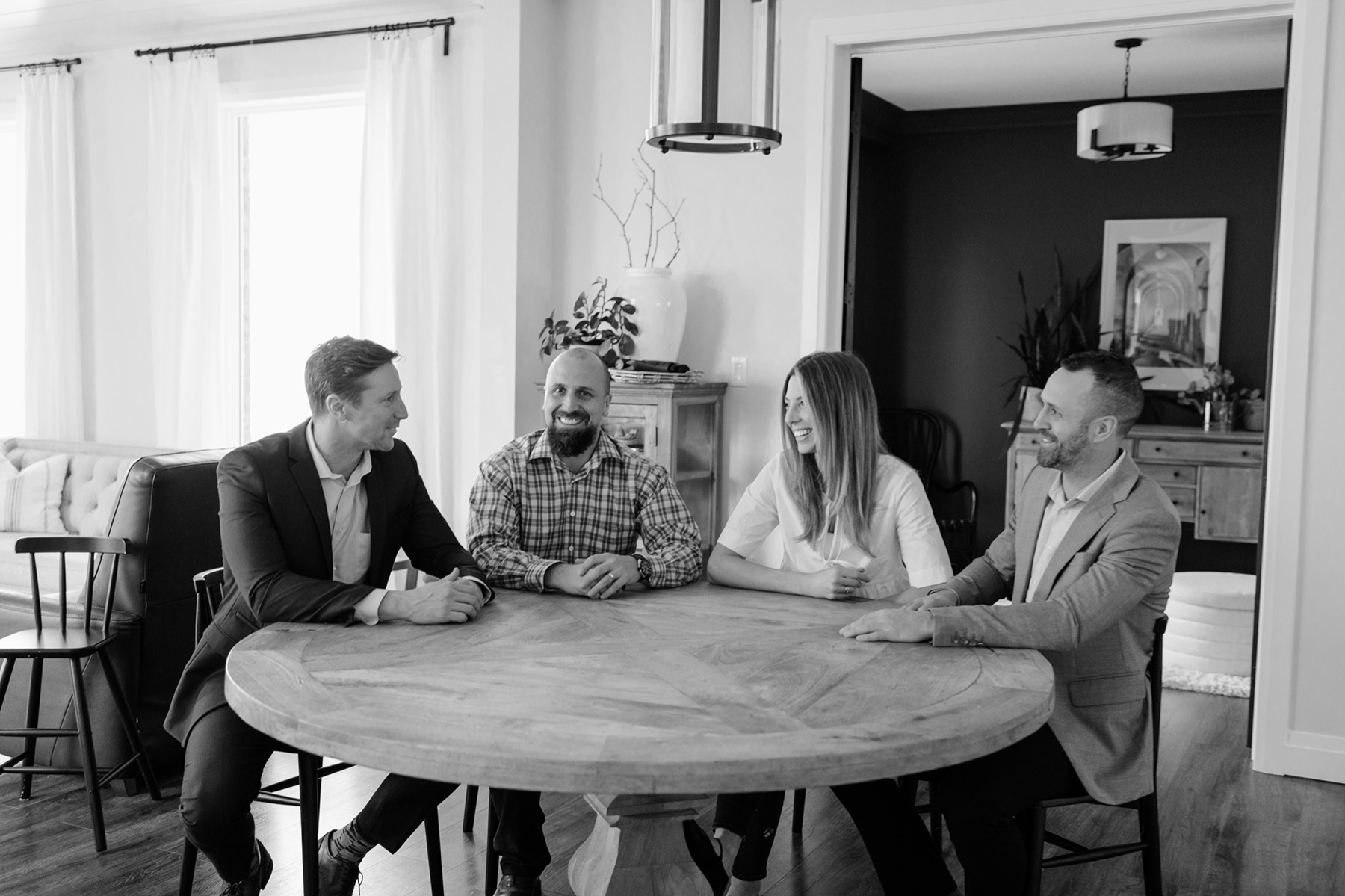 The CVE team in conversation around their office table